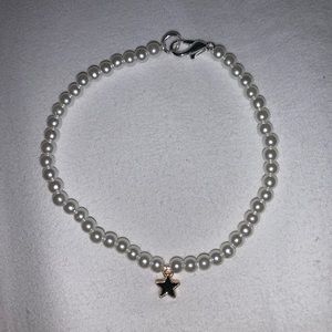 pearl bracelet with black star